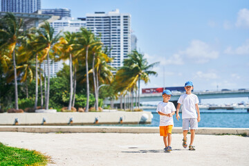 Picture from Miami of brothers walking on bay side