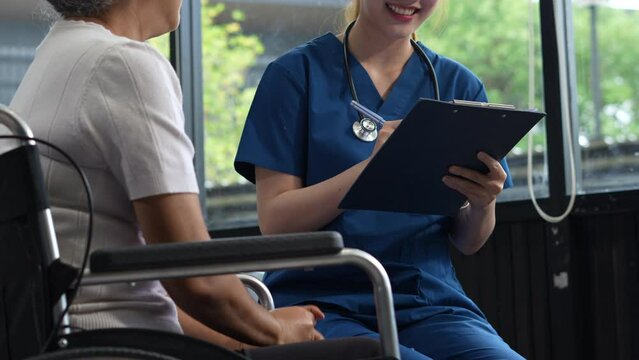 Doctor's hand reassuring elderly patient.