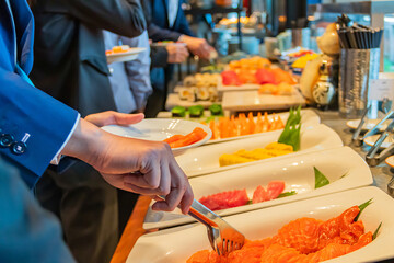 Close-up hand of chef take arranging food buffet japan food in hotel party, Food and drink