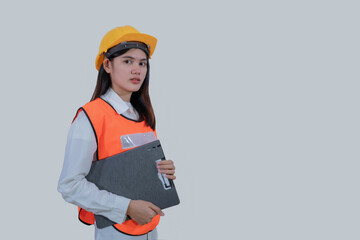 Asian engineer worker woman or architect with yellow safety helmet standing on isolated white background, construction concept, Engineer, Industry.