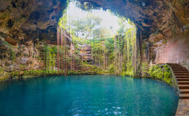 Ik-Kil Cenote near Chichen Itza, Mexico. Lovely cenote with transparent turquoise waters and hanging roots - Yucatan Peninsula, Mexico