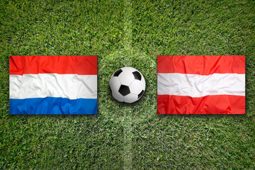 Netherlands vs. Austria flags on soccer field © BirgitKorber