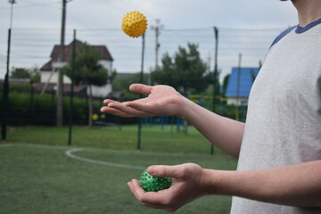 A young man in sportswear engages in a workout, using a sport tool for physical exercises on a...