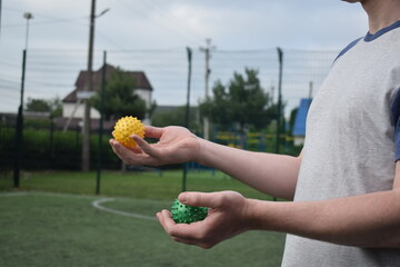 A young man in sportswear engages in a workout, using a sport tool for physical exercises on a...