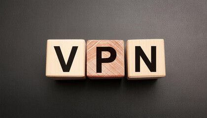 Obraz premium Wood blocks with abbreviation text VPN. Virtual private network. Secure connection. Top view, flat lay.