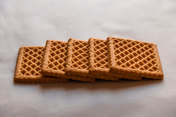 A biscuit is a flour-based baked and shaped food item especially popular in Britain usually served with tea or coffee