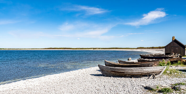 Fishermans cabin in a row by the sea. Huts on the island of gotland in Sweden.