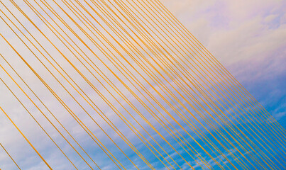 Architectural cable lines against a background of beautiful colorful sky and clouds.