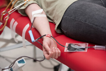 view of donor giving blood at donation center