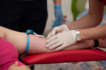 Laboratory and blood analysis concept. Close up cropped shot of professional nurse in gloves,...
