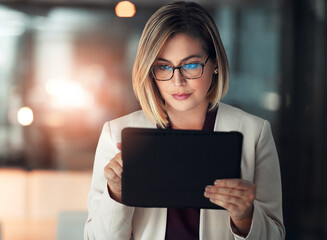 Corporate woman, tablet and working at night in office for company agenda, research and planning. Executive, technology and reading email or report for business results, growth and revenue with data