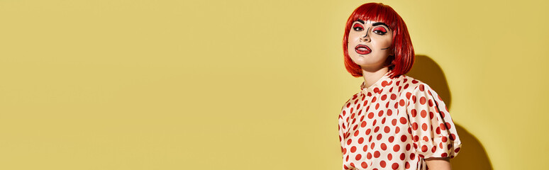A stunning redhead woman with pop art makeup and a polka dot blouse, reminiscent of a character from comics, set against a yellow background.