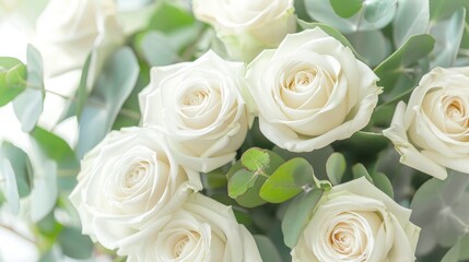 White roses with eucalyptus bouquet image