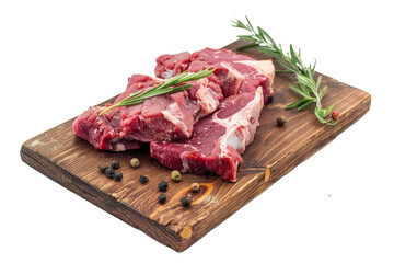 Freshly butchered meat cuts arranged on a rustic wooden board, white background