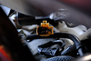 Check the electrical cable plug on the motorcycle.	
