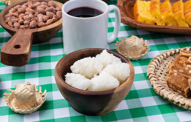 Typical brazilian june festival food over plaid fabric. Festa junina