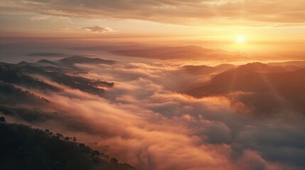 Scenic view of fog covered valley with mountains and hills at sunset