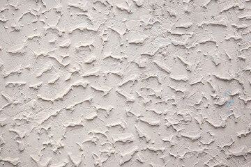 The wall has a textured surface with a pattern of lines