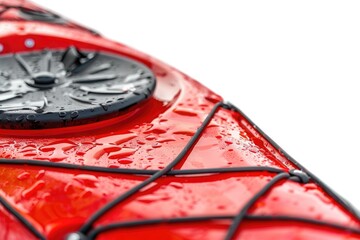Obraz premium A close-up shot of a red kayak with water droplets on its surface
