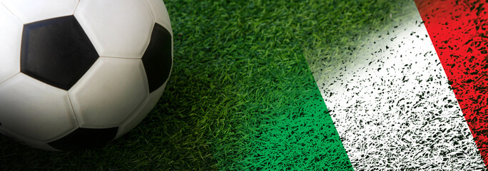 Soccer ball on green grass with  Italy nation flag banner  Football Euro 2024 tournament © wor_woot