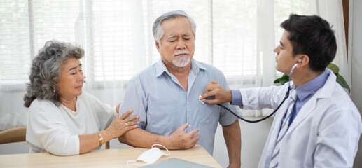 Obraz premium Doctor using stethoscope for auscultate Asian grandfather patient while older woman take care of him, service Life insurance, healthcare with Long live and Elderly society