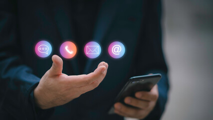 Website page contact us or e-mail marketing concept, Customer support hotline Contact us people connection. Label wood with the email, call phone, address, Chat message icons.