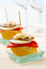 Spanish tapas food. Pintxo of piquillo pepper, egg, anchovy and mayonnaise..