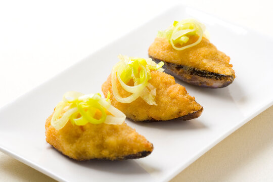 Stuffed, battered and fried mussels. Tiger mussels are a recipe from Cullera, Valencia, but spread throughout Spain...