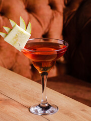 Cocktail glass isolated on wooden table