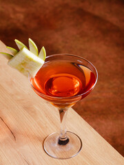 Cocktail glass isolated on wooden table