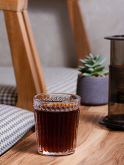Tea glass on wooden table 