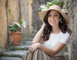 beautiful woman seated on steps
