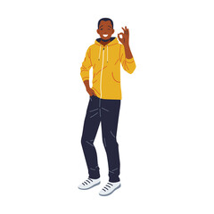 Fototapeta premium Portrait of a cheerful young African American man in casual attire, making the OK hand sign with a big smile. Conveys positive emotions, approval, and agreement. Isolated on white background