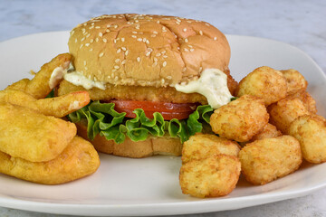 fish sandwich  with beer battered shrimp and tater tots