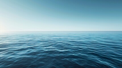 Obraz premium A serene seascape with navy waters stretching into the distance under a clear sky, evoking a sense of calmness and tranquility.