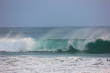 photo of waves rolling in the ocean