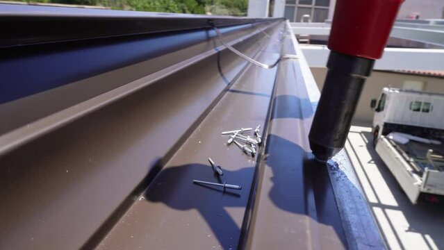 Roof drain. Drainage gutter for collecting rainwater. Gutter installation.