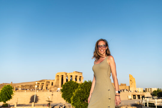 Woman in summer dress at Kom Ombo Temple, cultural exploration