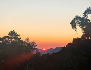 Beautiful Sunset with the view of the mountain. Sun setting behind the mountains