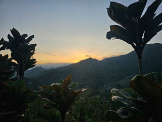Beautiful Sunset with the view of the mountain. Sun setting behind the mountains