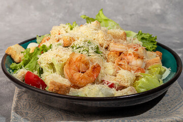 Salad with shrimp and croutons, tomatoes cheese, lettuce sauce. Boiled egg.