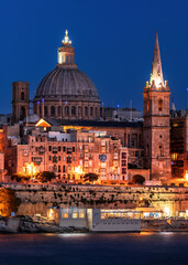 Naklejka premium View to Valletta skyline at night. Valletta is the tiny capital of the Mediterranean island nation of Malta.