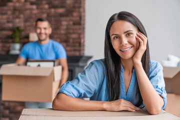 Young couple moving to new apartment together. Insurance, real estate, mortgage concept. Family wife and husband standing buying rent in new flat house home. New life - Powered by Adobe