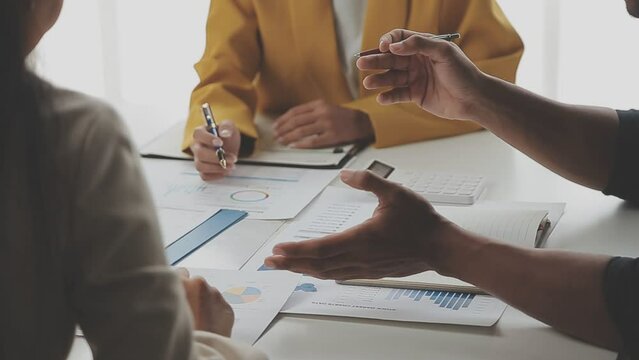 Entrepreneurs and business people conference in modern meeting room, happy multiracial coworkers have fun cooperating working together at office meeting, asian teamwork concept