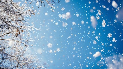 delicate white snowflakes falling gracefully against a clear, cerulean sky background, capturing the essence of a tranquil winter wonderland.