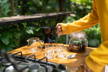 The process of brewing black coffee in a calm and relaxing atmosphere