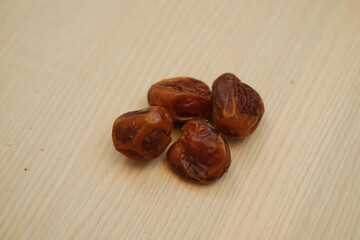 Dates fruit on wooden background. Healthy eating and dieting concept.