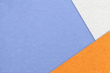 Texture of craft very peri color paper background with white and orange border. Vintage abstract blue cardboard.