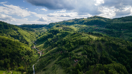 Naklejka premium Aerial top view forest tree, Forest ecosystem and healthy environment concept background, Texture of green tree forest view from above, Beautiful sunrise over the mountains of western Serbia.