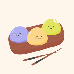 Mochi deserts with smiling face on a wooden board